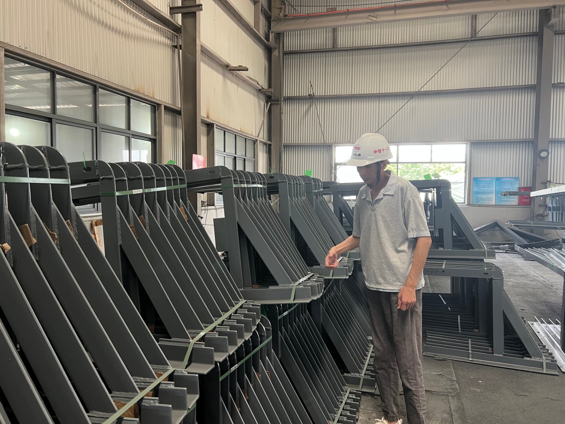 Coated rail components in a manufacturing facility